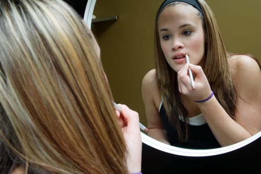 Applying lipstick