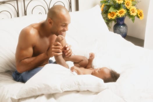 Father plays with baby