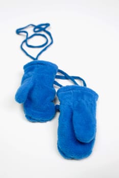 A pair of blue mittens