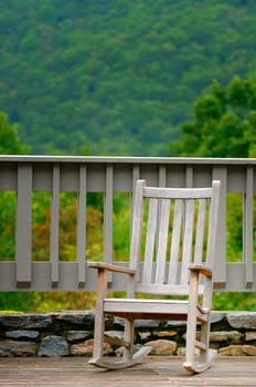 A rocking chair on a deck