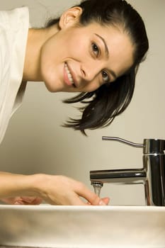 Woman preparing to wash up