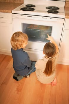 Children watching the oven
