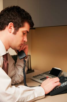 Man dialing phone number