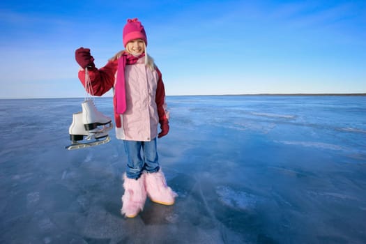 Girl holds skates