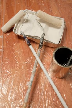 Paint rollers and paint can