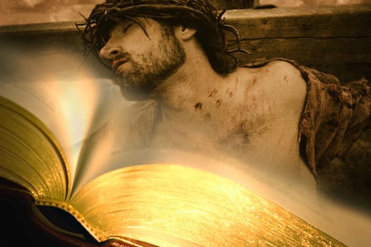Bible with Jesus on cross in background
