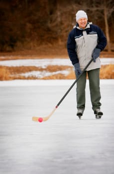 Man playing shinny hockey