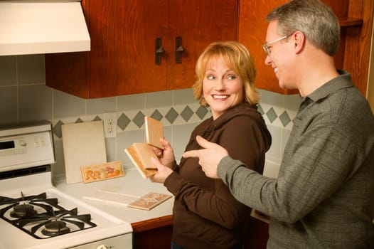 Couple choosing tile for kitchen