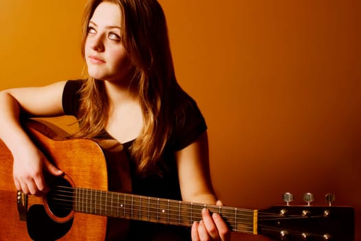 Woman playing guitar