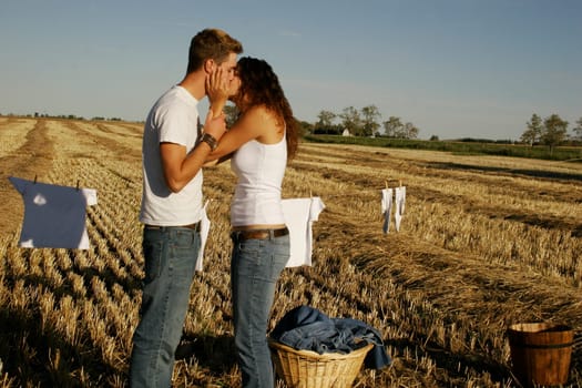 Couple hanging up laundry