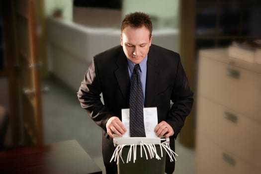 Office man catches tie in paper shredder