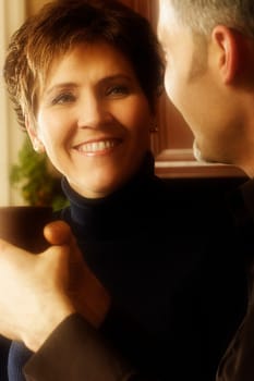 Man and woman conversing over coffee