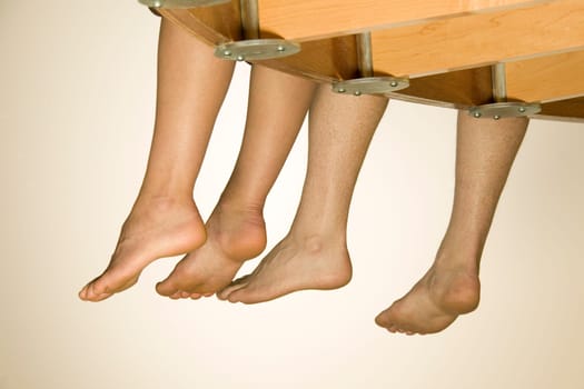 Feet Hanging Over Balcony
