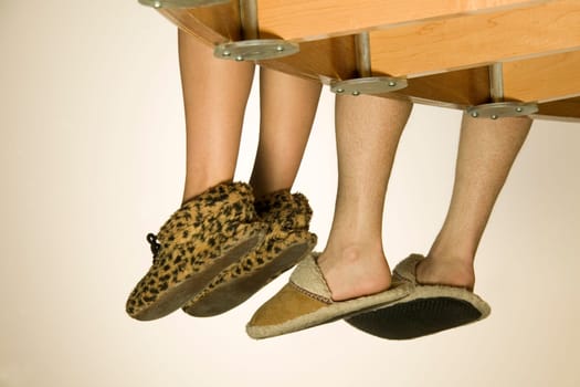 Feet Hanging Over Balcony