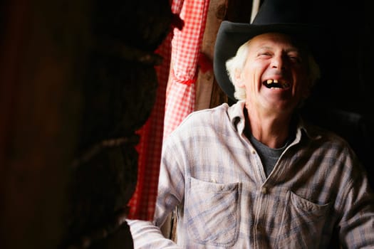 An older man laughing