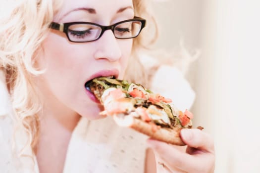 Woman eating pizza