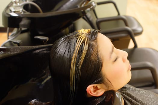 Getting hair washed at the hair salon