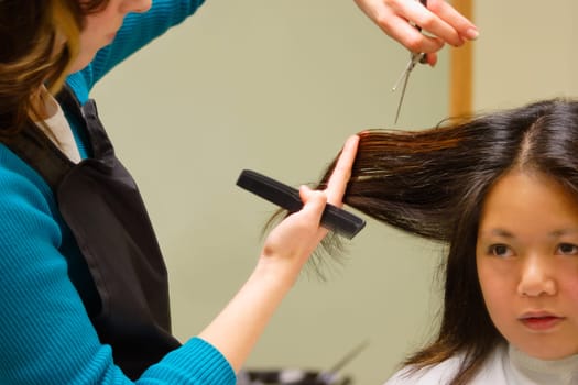 Woman getting a haircut