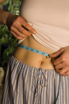 Woman measuring waist