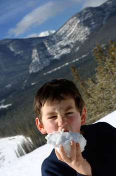 Boy eating snow