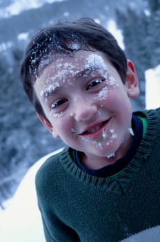 Boy with snow on his face