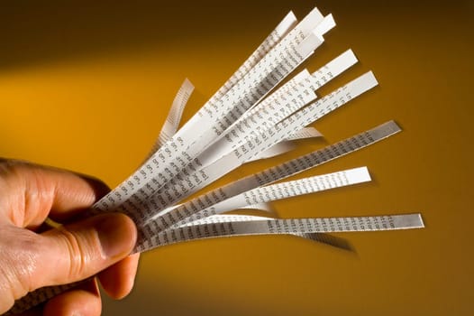 Hand holding shredded paper