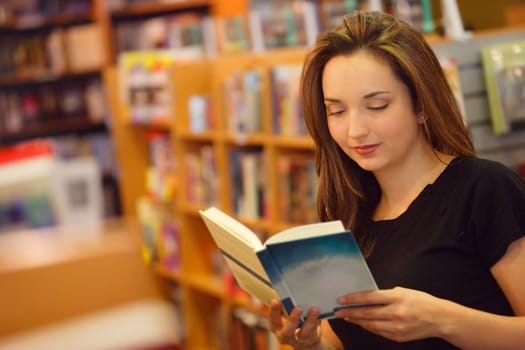 Student reading in library