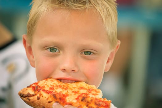 Boy eating pizza