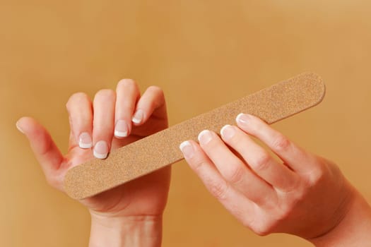 Fingernails being filed