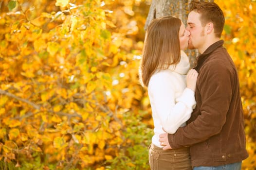Couple kissing in autumn