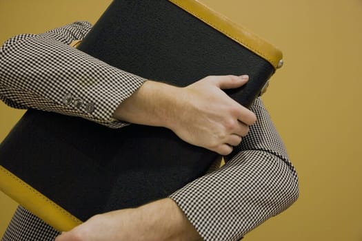 Arms wrapped around a book