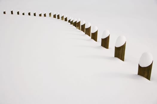Posts covered in snow