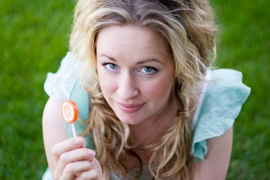 Young woman with lollipop
