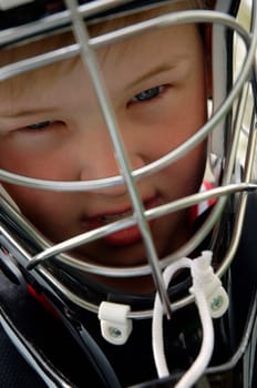 Boy wearing a goalie mask