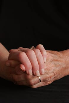 Senior couple holding hands