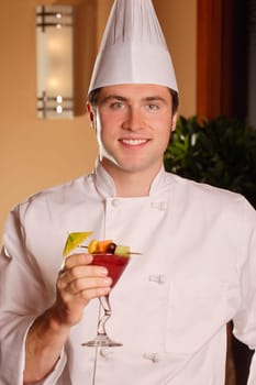 Chef holding tropical drink