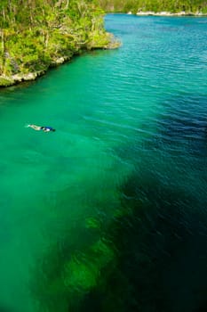 Single diver in expanse of water