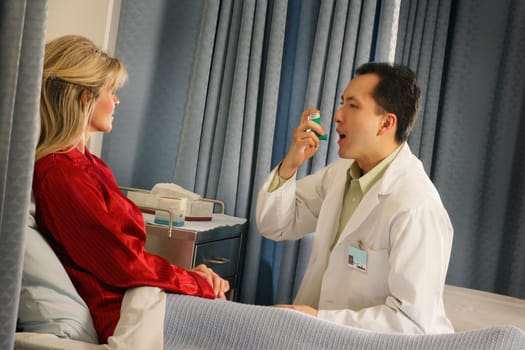 Doctor instructing patient with inhaler