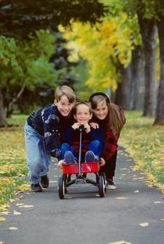 Children playing with wagon