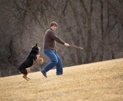 Man playing with dog