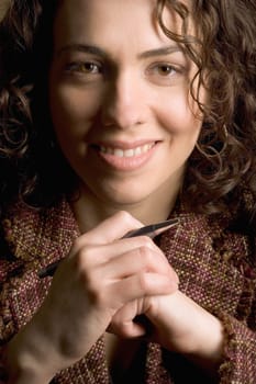 Smiling woman with pen