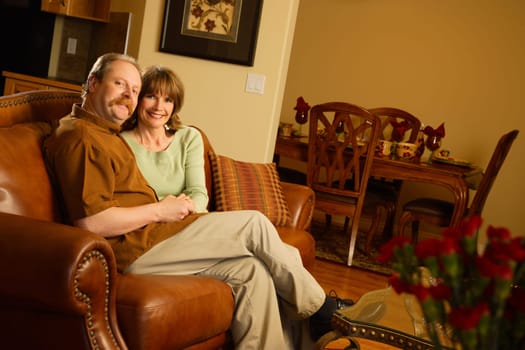 Couple sitting on sofa