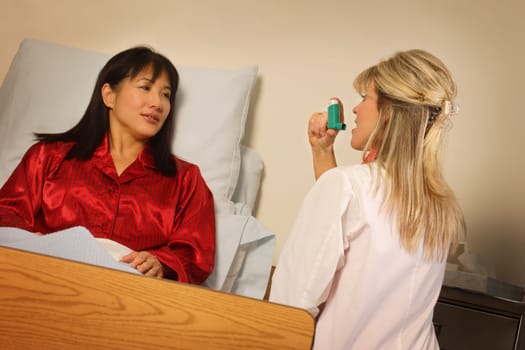 Doctor demonstrating inhaler to patient