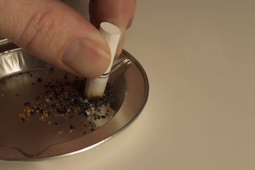 Butting out in an ashtray