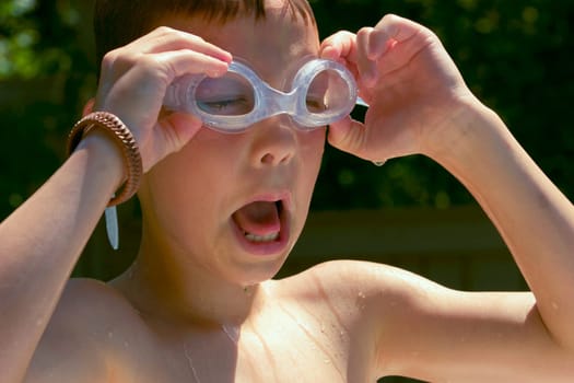 Boy with swimming goggles