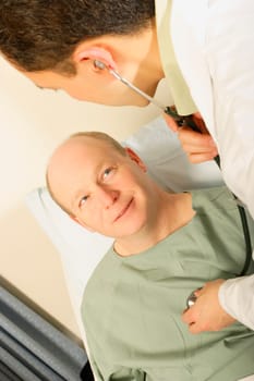 A doctor examines a patient using a stethoscope
