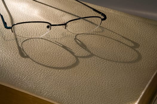 Reading glasses on book
