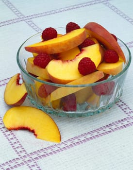 Raspberries and peach slices