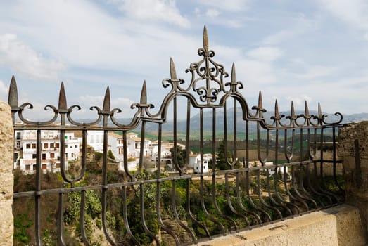 View of villas through iron railing