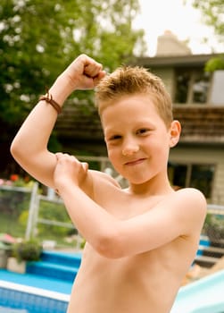 Boy feeling his bicep